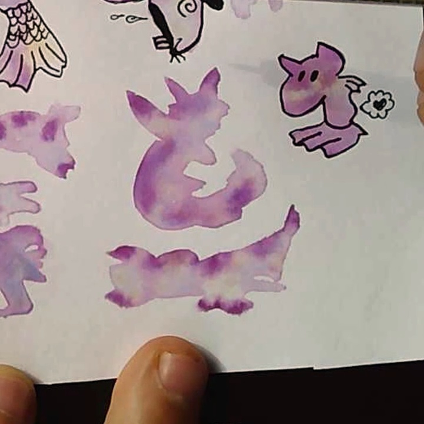 A close view of one untouched purple watercolor shape.