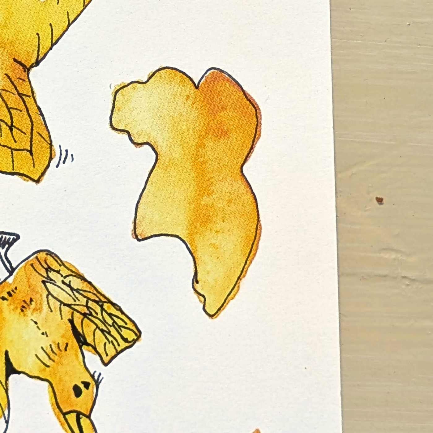 A close view of one untouched yellow watercolor shape.
