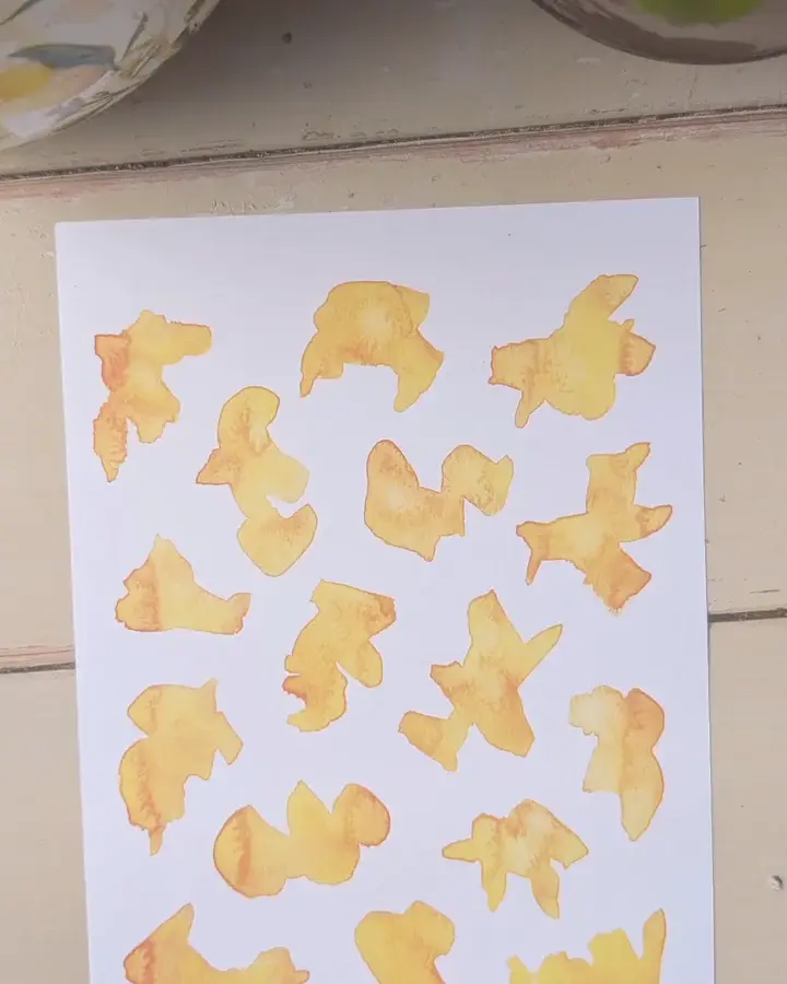 Animated sequence of a watercolor shape becoming a finished doodle.